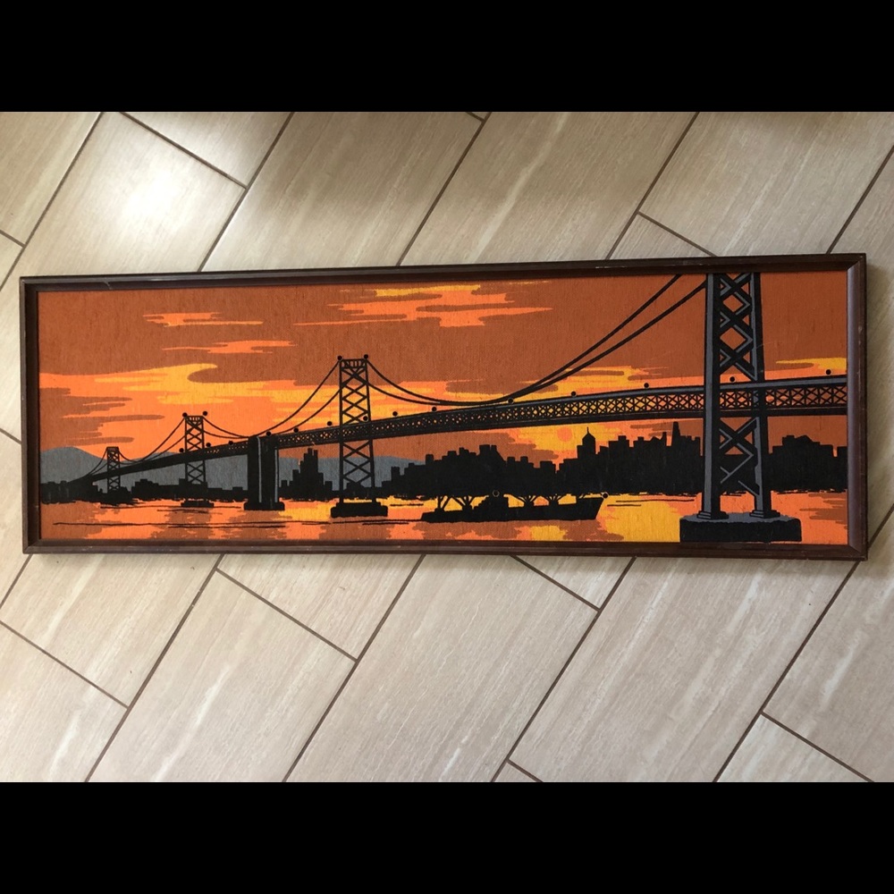 mid century bridge with city skyline